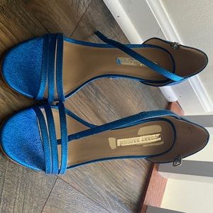 Electric blue strappy sandals. High heels. Very sexy.